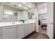 Bathroom featuring wood-look floors, double sinks, and a walk-in shower at 22854 E Pummelos Rd, Queen Creek, AZ 85142