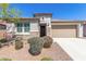 Beautiful single-story home showcasing desert landscaping and an attached two-car garage at 22854 E Pummelos Rd, Queen Creek, AZ 85142