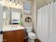 Bathroom featuring a single sink vanity with warm wood cabinets at 23123 N Cardenas Dr, Sun City West, AZ 85375