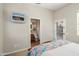 Bright bedroom with en-suite bathroom access and natural light at 23123 N Cardenas Dr, Sun City West, AZ 85375