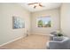 Cozy room with neutral decor, two armchairs, and bright window at 23123 N Cardenas Dr, Sun City West, AZ 85375