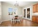 Charming dining area with a table and chairs, natural light, and sliding glass door access at 23123 N Cardenas Dr, Sun City West, AZ 85375