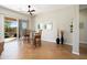 Bright dining area with views of the landscaped backyard through sliding glass doors at 23123 N Cardenas Dr, Sun City West, AZ 85375