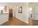 Inviting foyer featuring tile flooring, neutral walls, and a view of the front entry door at 23123 N Cardenas Dr, Sun City West, AZ 85375