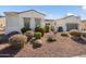 Landscaped front yard with desert plants, decorative rock, and solar panels at 23123 N Cardenas Dr, Sun City West, AZ 85375