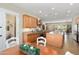 Open kitchen featuring stainless steel appliances, an island, and an adjoining dining space at 23123 N Cardenas Dr, Sun City West, AZ 85375