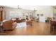 Inviting living room with tile floors, ceiling fans, and access to the outdoor patio at 23123 N Cardenas Dr, Sun City West, AZ 85375