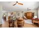 Spacious living room with seamless transition to the kitchen, dining, and seating areas at 23123 N Cardenas Dr, Sun City West, AZ 85375