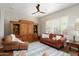 Cozy living room with a built in, ceiling fan, and large window for natural light at 23123 N Cardenas Dr, Sun City West, AZ 85375