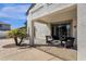 Comfortable covered back patio with chairs at 2417 W Apache Rain Rd, Phoenix, AZ 85085