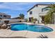 Inviting pool with rock waterfall feature and patio area, perfect for outdoor living and entertaining at 2417 W Apache Rain Rd, Phoenix, AZ 85085