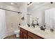 Bathroom featuring double sinks, a shower/tub, and stylish decor at 2417 W Apache Rain Rd, Phoenix, AZ 85085