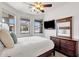 Bright bedroom featuring a ceiling fan, natural light, and ample storage space at 2417 W Apache Rain Rd, Phoenix, AZ 85085