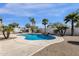 Sparkling private pool with rock waterfall feature surrounded by lush tropical landscaping at 2417 W Apache Rain Rd, Phoenix, AZ 85085