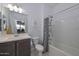 Bathroom with modern fixtures including framed mirror and bath tub shower combination at 30116 W Fairmount Ave, Buckeye, AZ 85396