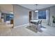 Dining room with modern finishes adjacent to living area, bathed in natural light at 30116 W Fairmount Ave, Buckeye, AZ 85396