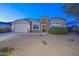 Well-manicured front yard and a charming single-story home, with a two-car garage at 30116 W Fairmount Ave, Buckeye, AZ 85396