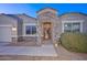 Charming front entrance featuring stone accents and a covered porch at 30116 W Fairmount Ave, Buckeye, AZ 85396