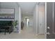 Elegant hallway with tile flooring, neutral paint and natural lighting, leading to the main living areas at 30116 W Fairmount Ave, Buckeye, AZ 85396