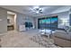 Bright and airy living room with sliding glass doors leading to the outdoor living area at 30116 W Fairmount Ave, Buckeye, AZ 85396