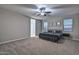 Spacious primary bedroom with a ceiling fan, large windows and neutral color palette at 30116 W Fairmount Ave, Buckeye, AZ 85396