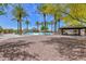 A vibrant community playground shaded by mature palm trees and featuring play equipment and picnic areas at 30116 W Fairmount Ave, Buckeye, AZ 85396