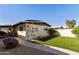 Exterior view of backyard featuring low maintenance lawn, patio, and partial wall at 322 W Laguna Dr, Tempe, AZ 85282