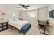 Bedroom with neutral carpet, a ceiling fan, and a cozy seating area at 322 W Laguna Dr, Tempe, AZ 85282