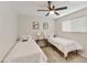 Bedroom with ceiling fan, neutral walls, two beds and carpet at 322 W Laguna Dr, Tempe, AZ 85282