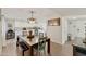 Open-concept kitchen with a dining table and white cabinetry at 322 W Laguna Dr, Tempe, AZ 85282