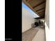 Exterior view of covered patio featuring furniture, BBQ, and concrete flooring at 322 W Laguna Dr, Tempe, AZ 85282