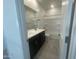 Bright bathroom with double sink vanity, neutral paint and tile, and a shower-tub combo at 4517 S Mole --, Mesa, AZ 85212