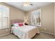 Bedroom featuring carpet floors, ceiling fan, plantation shutters, and neutral walls providing a relaxing and well-lit retreat at 4542 E Carob Dr, Gilbert, AZ 85298