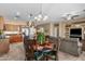 Bright dining area showcasing access to the kitchen, living room, and decorated table and chairs at 4542 E Carob Dr, Gilbert, AZ 85298