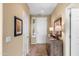 Welcoming entryway with neutral walls, decorative furniture, and a glimpse of the front door at 4542 E Carob Dr, Gilbert, AZ 85298