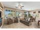 Cozy living room with tile flooring, plantation shutters, and a comfortable seating area at 4542 E Carob Dr, Gilbert, AZ 85298