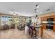 Inviting living room featuring tile flooring, bright windows, and an open-concept to the kitchen at 4542 E Carob Dr, Gilbert, AZ 85298