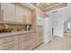 Well-lit kitchen with bright cabinets, tiled backsplash, stone countertops, and tiled floors at 5165 E Tunder Dr, Phoenix, AZ 85044