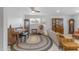 Comfortable living room with vintage furniture, a round rug, and plenty of natural light at 5165 E Tunder Dr, Phoenix, AZ 85044