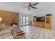 Bright living room features a cozy fireplace, tiled floors, and access to outdoor space through French doors at 5165 E Tunder Dr, Phoenix, AZ 85044