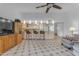 Bright living area with kitchen bar, wooden entertainment center and tiled flooring at 5165 E Tunder Dr, Phoenix, AZ 85044