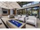 Relaxing lounge area with modern chairs surrounding a blue fire pit in a luxury community space at 5250 E Deer Valley Dr # 343, Phoenix, AZ 85054