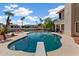 Backyard pool with diving board and patio area for entertaining at 5471 W Quail Ave, Glendale, AZ 85308