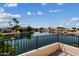 Balcony view showing a tranquil waterfront setting under a bright, blue sky at 5471 W Quail Ave, Glendale, AZ 85308