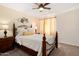 Cozy bedroom featuring a decorative bedframe, a ceiling fan, and light-colored walls for a relaxing atmosphere at 5471 W Quail Ave, Glendale, AZ 85308