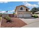 Two-story home featuring a three-car garage and well-maintained landscaping at 5471 W Quail Ave, Glendale, AZ 85308