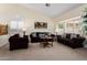 Cozy living room featuring neutral paint and comfortable seating at 5471 W Quail Ave, Glendale, AZ 85308