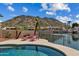 Enjoy a private backyard pool with lake views and mountain scenery at 5471 W Quail Ave, Glendale, AZ 85308