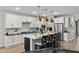 Stylish kitchen with an island, stainless steel appliances, and modern pendant lighting at 5644 N 206Th Gln, Buckeye, AZ 85396