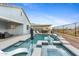 An inviting swimming pool with a spa, a lounge chair, and a desert landscape backdrop at 5644 N 206Th Gln, Buckeye, AZ 85396